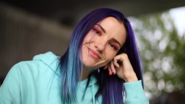 Cute Girl with Blue Hair Smiling