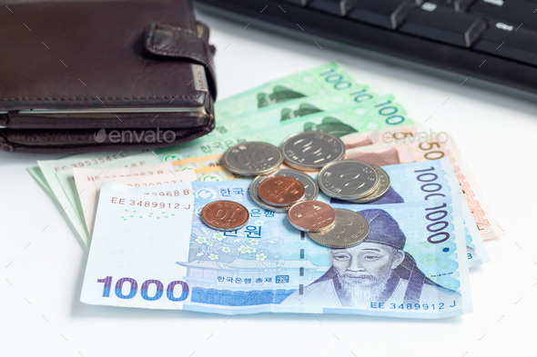 Different value South korean currency bill and coins near wallet , save your money concept