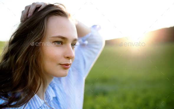 Portrait of young teenager girl outdoors in nature at sunset Stock ...