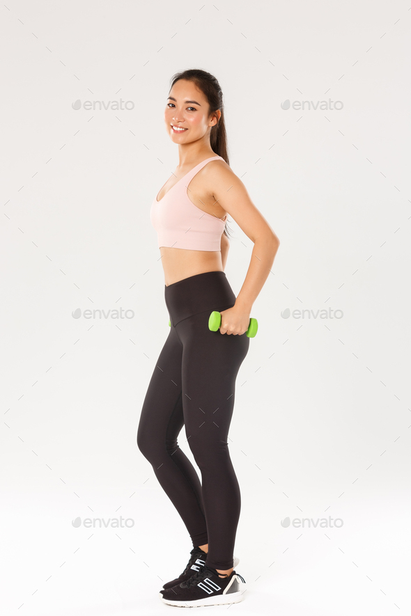 Sport, gym and healthy body concept. Full length of sweaty smiling