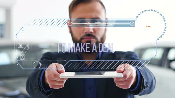 Businessman Holds a Tablet with HUD Futuristic Elements. Hologram with an Inscription - To Make a