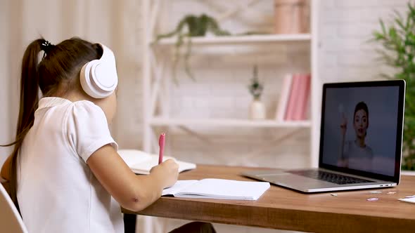 Little Child Girl Using Laptop Computer for Studying Online E-learning System