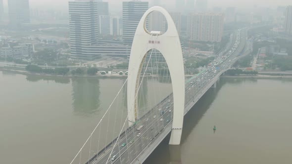 Liede Bridge on Pearl River. Guangzhou City in Smog, China. Aerial View alt