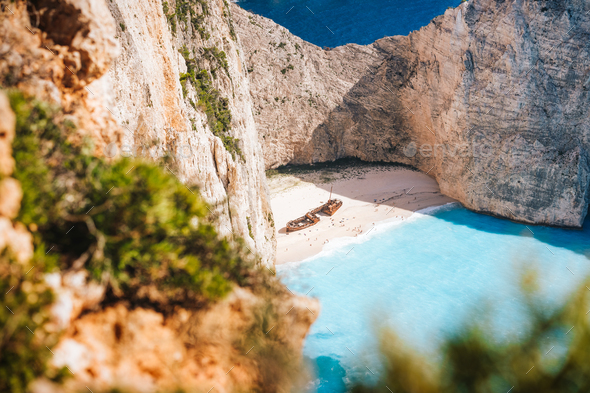 Famous shipwreck on Navagio beach. Blue sea cove surrounded by huge white limestone cliffs. Famous - Stock Photo - Images