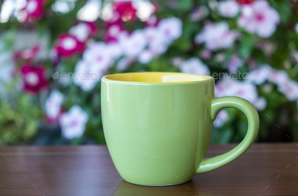 Download Placeit Coffee Cup Mockup On A Table Blur Green Background Stock Photo By Rawf8