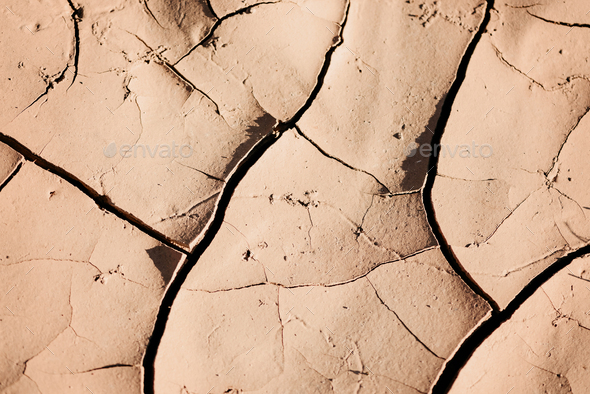 Water crisis. Cracked earth. Global warming problem. Dry land ground. Desert concept. Cracked soil