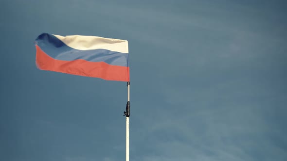 Handheld Shot of Flag Russian Federation Waving Outside