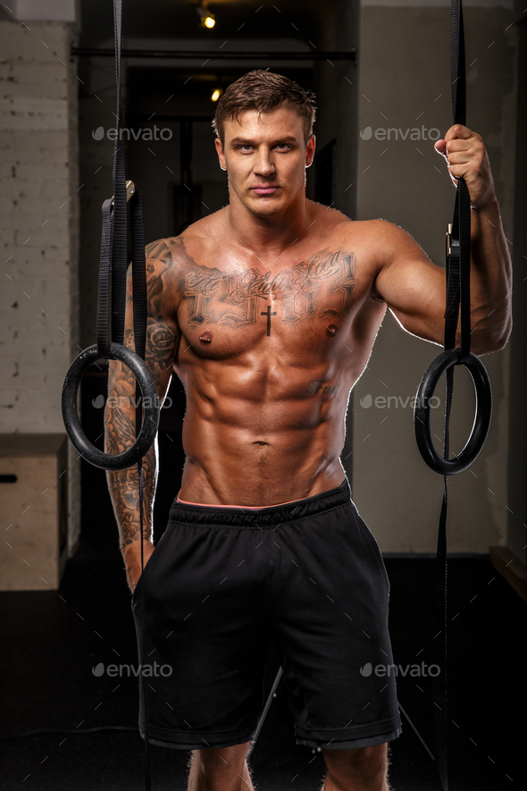 Muscular Man With Tattooes In A Gym Stock Photo By Fxquadro Photodune