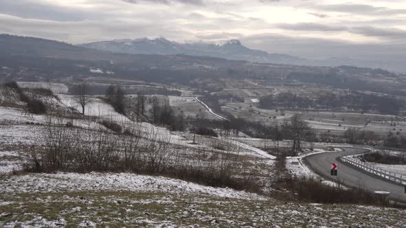 Pan of road and hills alt