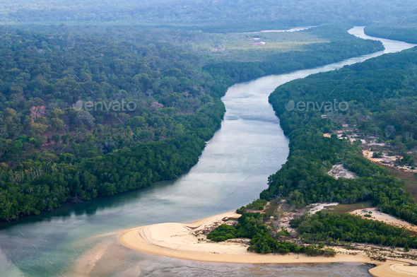 Aerial view to the ocean coast, river and rainforest. Aerial view to the ocean coast, river and rainforest. Australia Northern Territory. Cape York. Scenic flight.