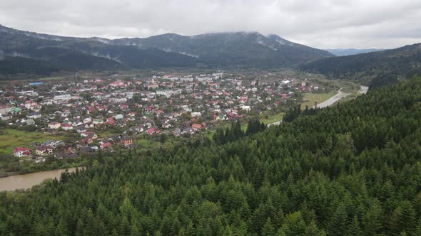 Village in the Carpathian Mountains in Autumn. Slow Motion, Aerial View alt