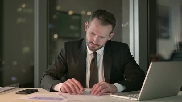 Smart Businessman Working and Leave the Office Desk at Night alt