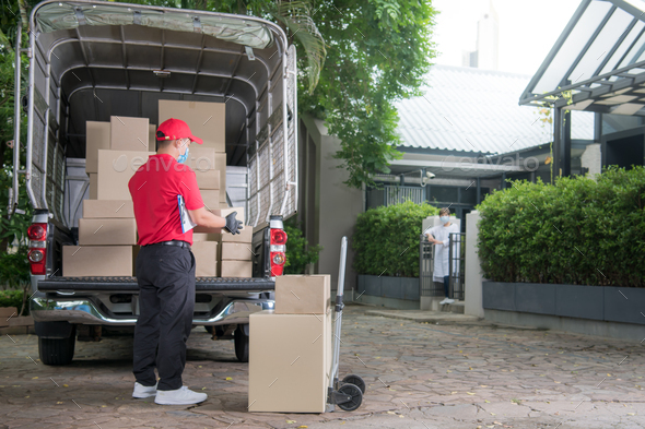 Delivery man with protective mask and gloves delivering parcels