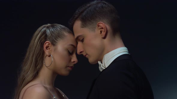Ballroom Couple Standing in Dark Background alt