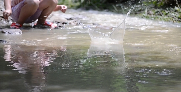 Child Playing Near River