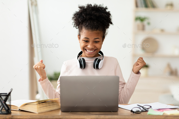 Excited Girl At Laptop Gesturing Yes Getting A-Grade At Home