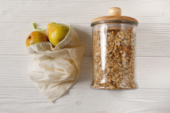 Eco natural bags with fruits and granola in glass