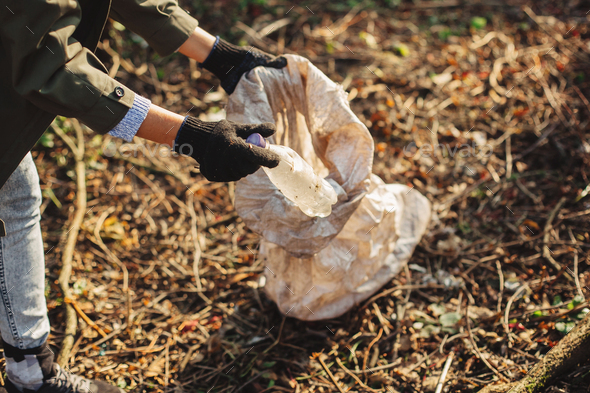 hand picking up trash