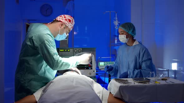 Surgeon Doing Surgery in Operating Room in Hospital