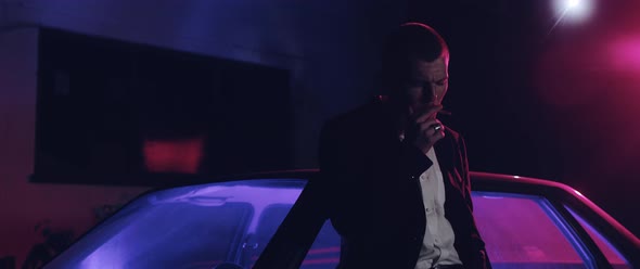 Man smoking at night alt