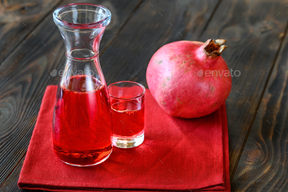 Glass jug of grenadine syrup