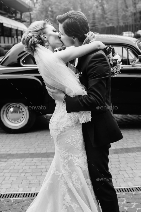 Gorgeous Bride In Vintage White Wedding Dress With Bouquet Hugging With Handsome Groom Stock 7197