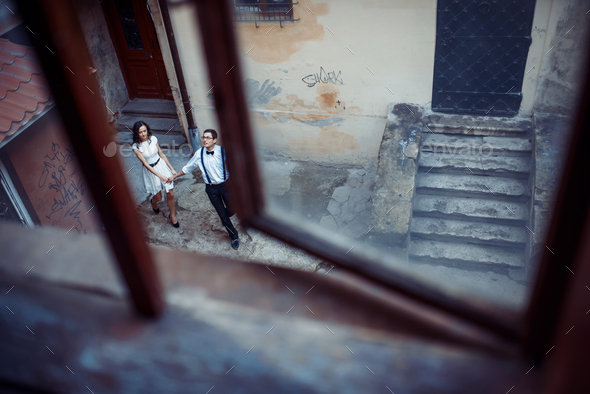 happy and loving couple walking and make photo in the old city - Stock Photo - Images