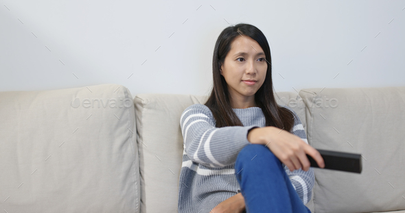 Woman watch tv at home - Stock Photo - Images
