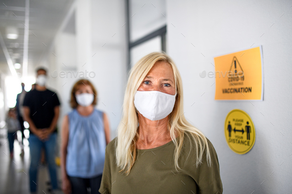 Portrait of old people with face masks waiting, coronavirus, covid-19 and vaccination concept.