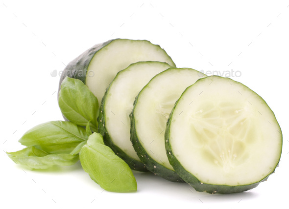 Sliced cucumber vegetable and basil leaves still life - Stock Photo - Images