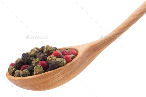 Pepper seasoning  mix in wooden spoon isolated on white background cutout - Stock Photo - Images