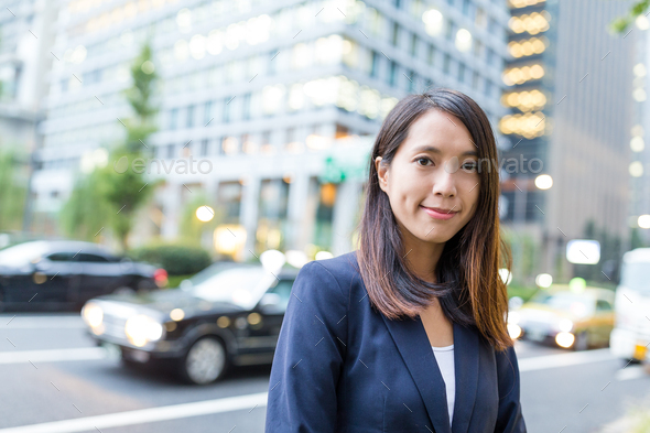 Young business woman in Tokyo city - Stock Photo - Images