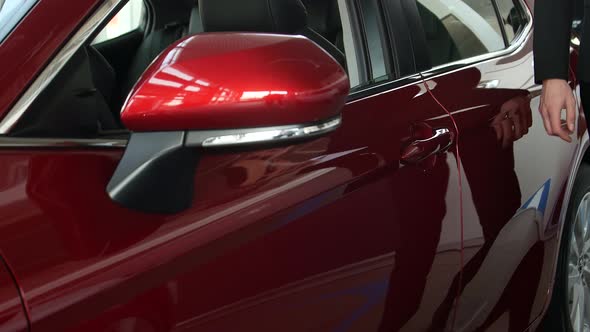 Auto business, car sales, seller with a folder in your hands alt