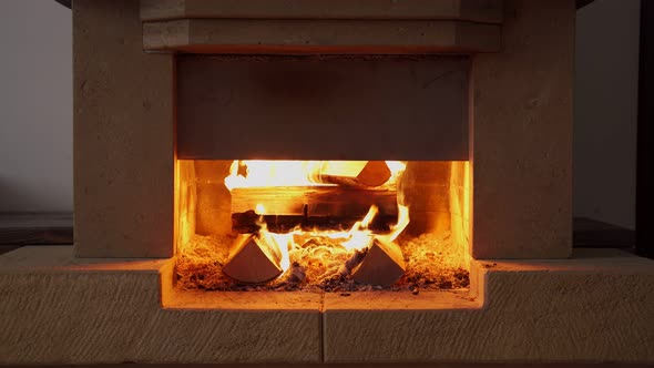 Fireplace Lit Inside the House alt