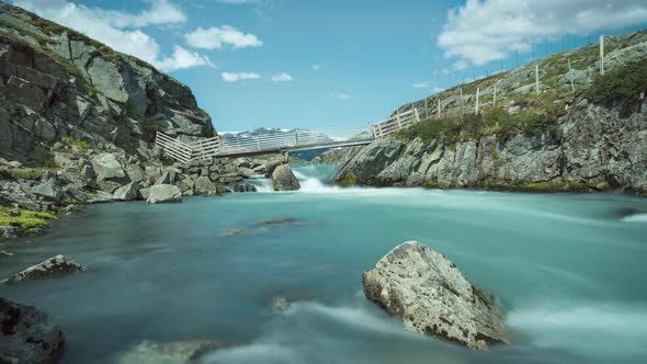 Long exposure time lapse of fast flowing mountain river alt