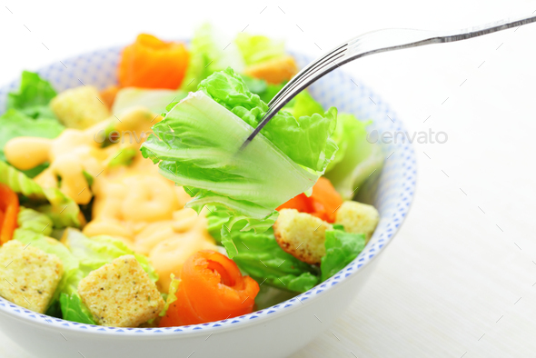 Salmon salad with silver fork - Stock Photo - Images