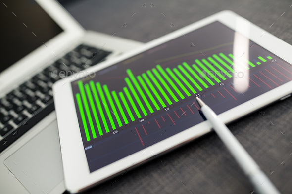 Business charts and diagrams on digital tablet - Stock Photo - Images