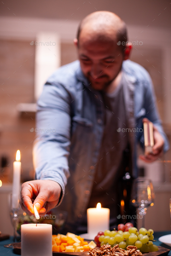 Man lighting the candle Stock Photo by DC_Studio PhotoDune