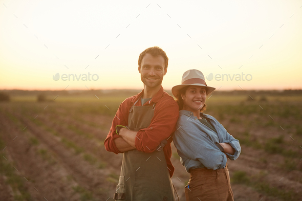 Couple of Farmers in Field - Stock Photo - Images