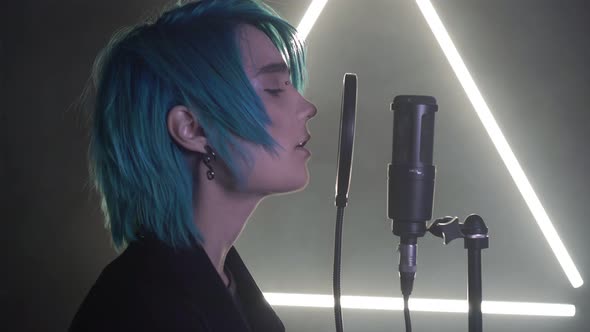 A Man Sings in a Professional Recording Studio alt