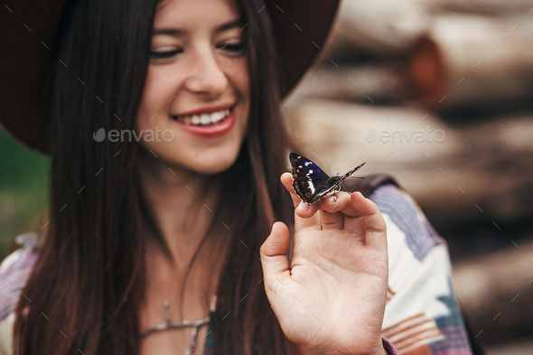 Beautiful butterfly on girl hand - Stock Photo - Images