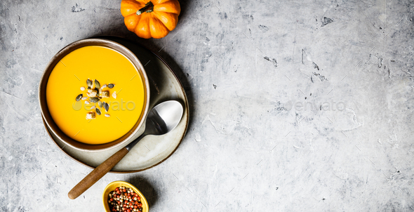 Vegetarian autumn pumpkin cream soup with seeds - Stock Photo - Images