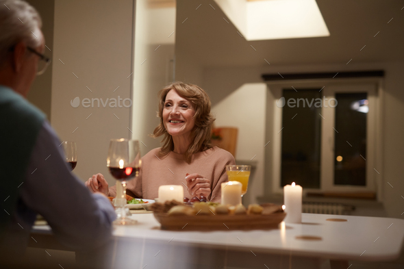 Happy woman has dinner with her husband - Stock Photo - Images