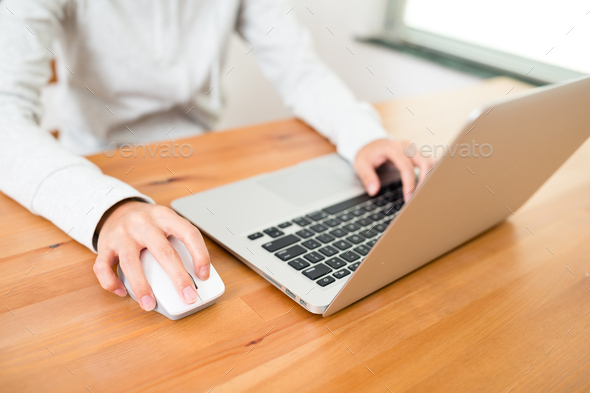 Woman using laptop computer - Stock Photo - Images