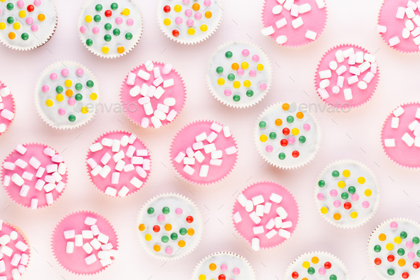 Colorful cupcakes on a white background. - Stock Photo - Images