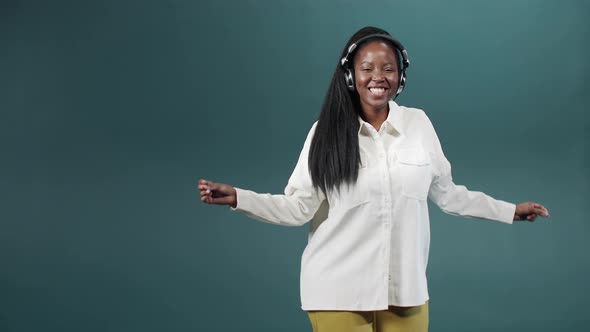 A Young African Lady is Dancing Delightfully in Slow Motion alt