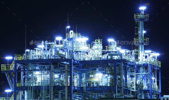 Oil and gas refinery at night - Stock Photo - Images