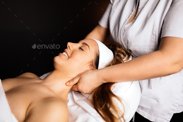 Beautiful woman enjoying massage - Stock Photo - Images