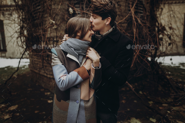 Romantic stylish couple hugging gently in autumn park - Stock Photo - Images