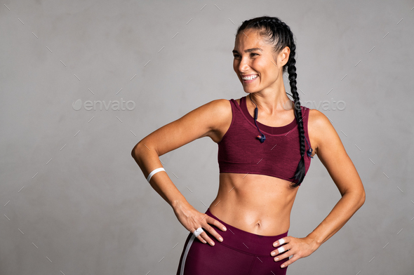 Mid smiling woman smiling after fitness training Stock Photo by Rido81